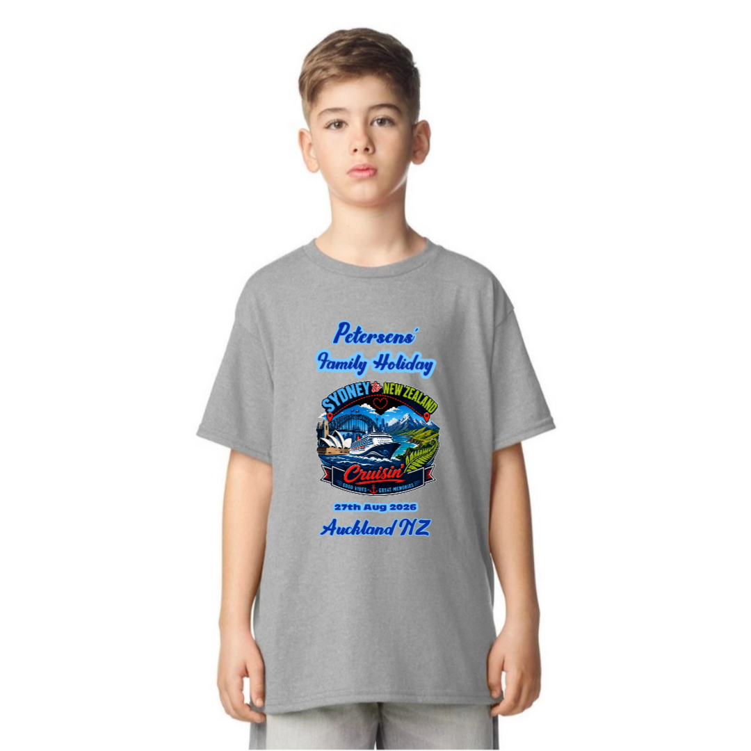 Young girl wearing a personalised Sports Grey Gildan 64000B Youth Tee with front print for a Sydney to New Zealand cruise, featuring family name, cruise date and Auckland NZ destination.