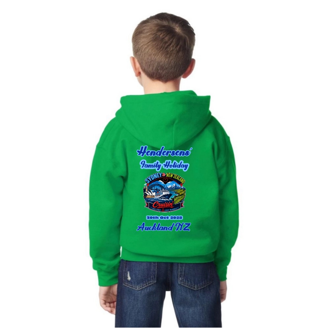 Youth wearing a personalised Irish Green Gildan 18500B kids hoodie with back print for a Sydney to New Zealand cruise, featuring family holiday text, Auckland NZ destination and October 2028 travel date.